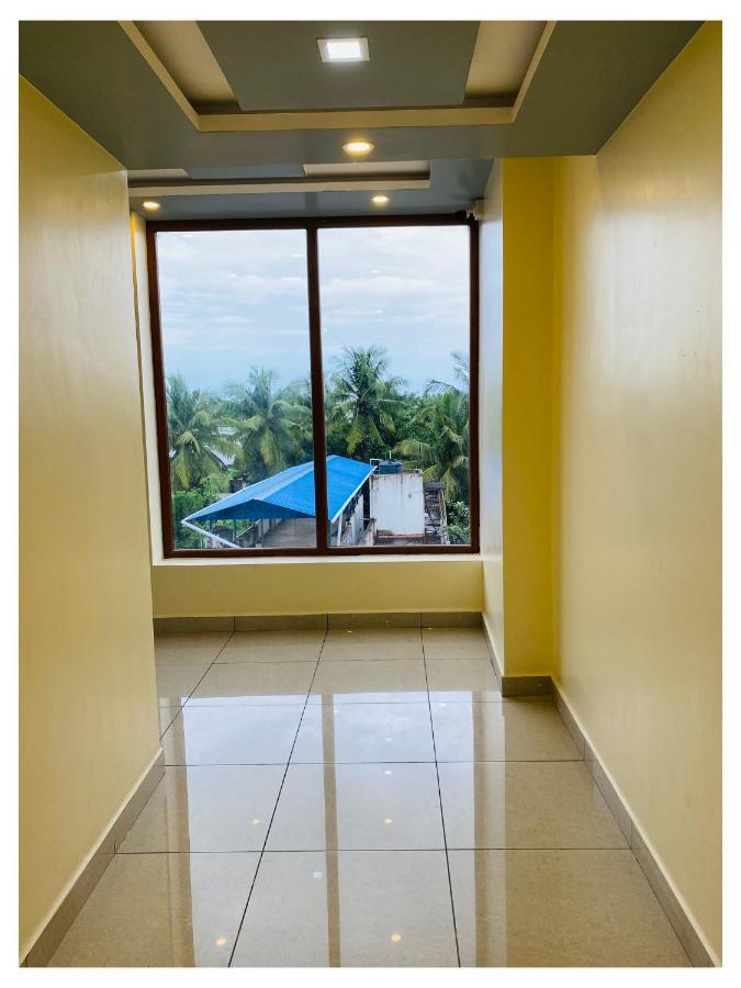 The Landmark Tower Tirunallar Bagian luar foto